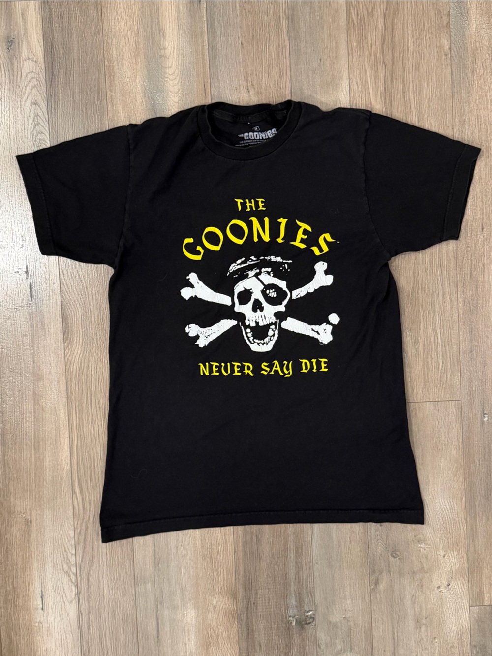 Black Graphic THE GOONIES Tee with Yellow Skull Print